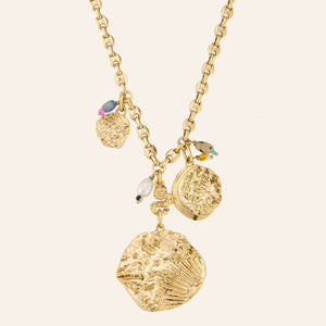 Gold Coin Charm Necklace on Tan Background