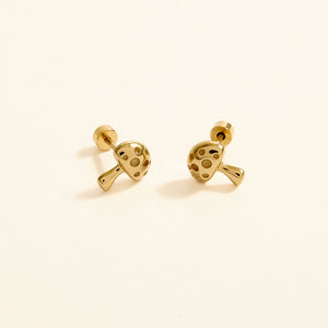 Gold Mushroom Stud Earrings on Tan Background