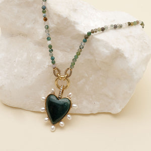 Stone and Pearl Heart Pendant Necklace Styled on Stone