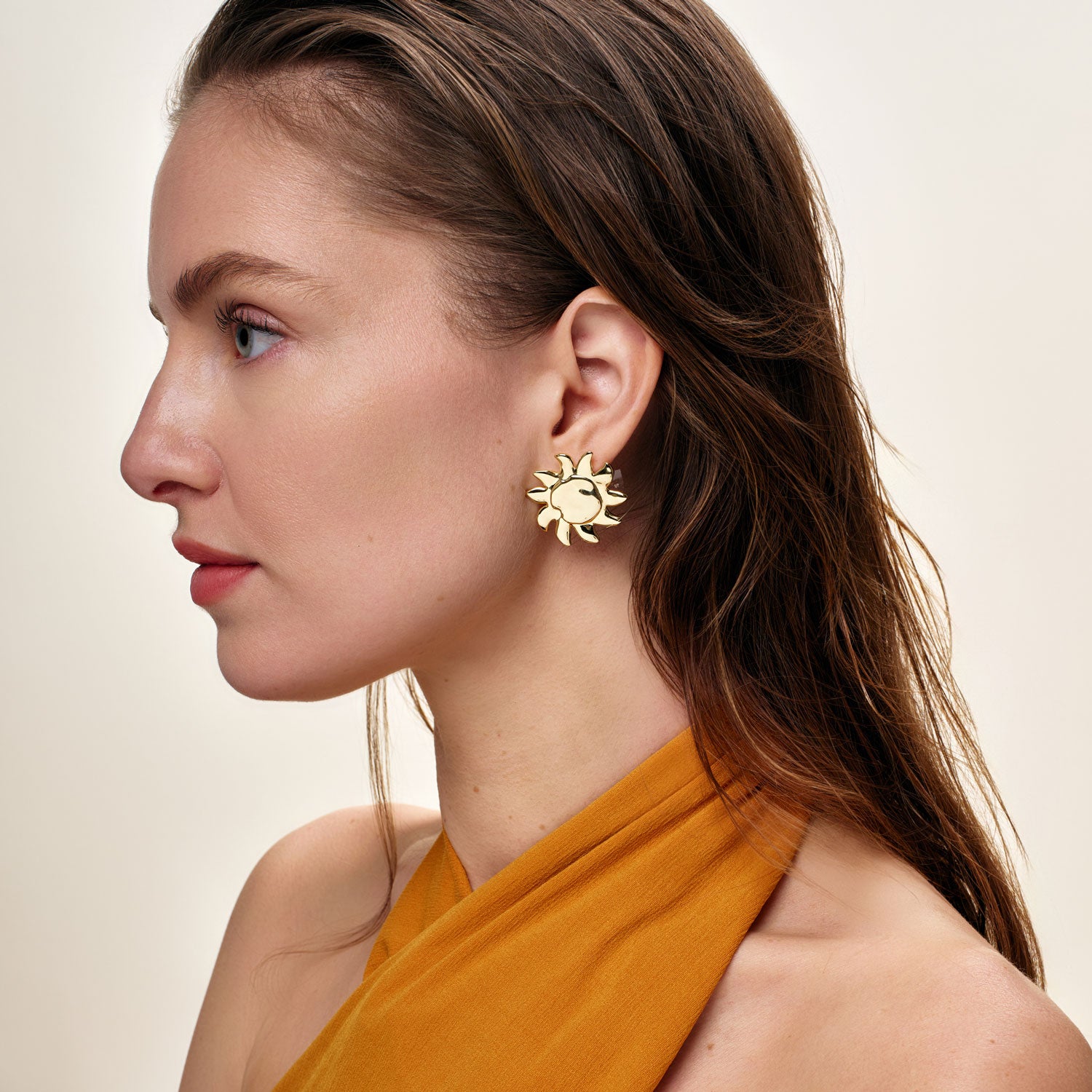 Gold Sun Stud Earrings Styled on Model