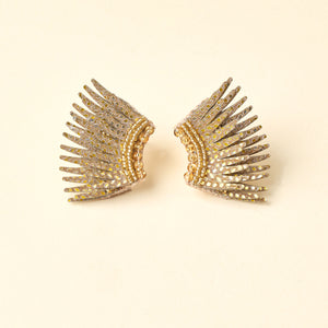 Glitter Gold Sequin and Bead Wing Stud Earrings on Tan Background