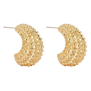 Gold Textured Hoop Earrings On Flat White Background