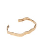 Gold Wavy Cuff Bracelet on Flat White Background