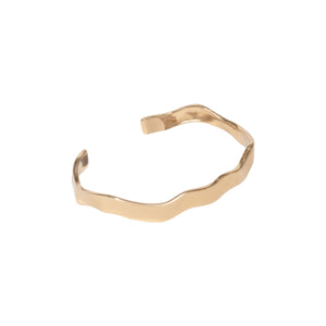 Gold Wavy Cuff Bracelet on Flat White Background