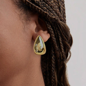 Gold and Clear Crystal Stud Earrings on Model's Ear