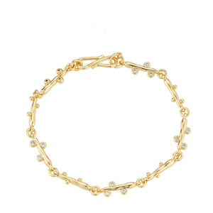 Gold and Crystal Chain Bracelet on Flat White Background