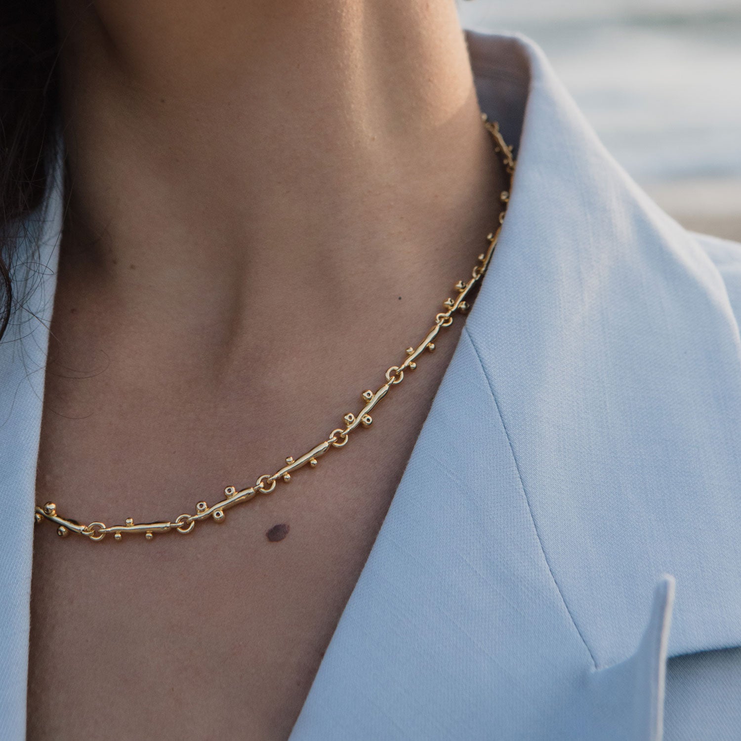 Gold and Crystal Chain Necklace Styled on Model