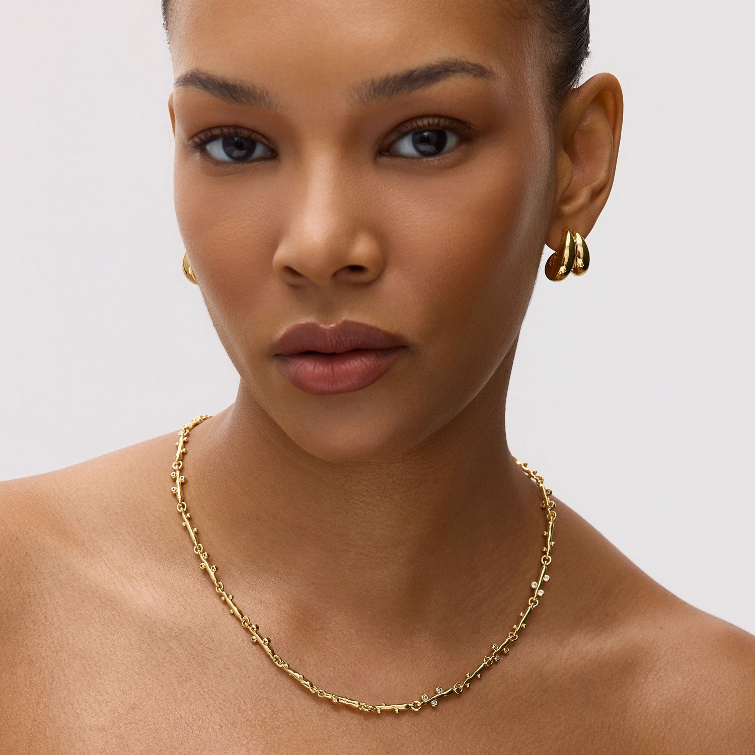 Gold and Crystal Chain Necklace Styled on Model