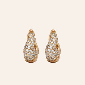 Gold and Crystal Hoop Earrings on Tan Background