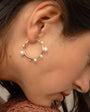 Gold and Multi-Sized White Pearl Hoop Earrings Styled on Model