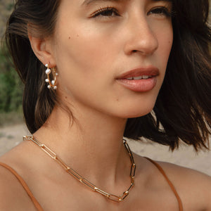 Gold and Multi-Sized White Pearl Hoop Earrings Styled on Model