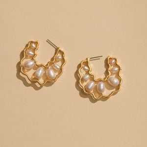 Gold and Freshwater Pearl Hoops Staged on Flat Cream Background