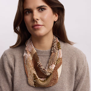 Gold and Tan Beaded and Embroidered Scarf Necklace on Model in Tan Sweater