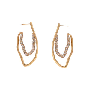 Gold and Pave Hoop Earrings On Flat White Background
