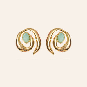 Green Stone and Gold Spiral Stud Earrings on Cream Background