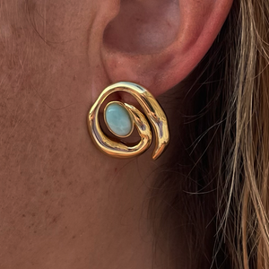 Green Stone and Gold Spiral Stud Earrings on Model's Ear