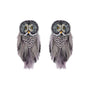 A pair of owl-shaped earrings made with gray and black feathers, silver rhinestones, and yellow eyes, shown against a plain white background.