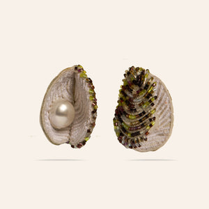 Beaded and Embroidered Oyster Shell Earrings on Tan Background