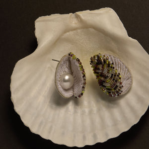 Beaded and Embroidered Oyster Shell Earrings Staged on Shell with Black Background