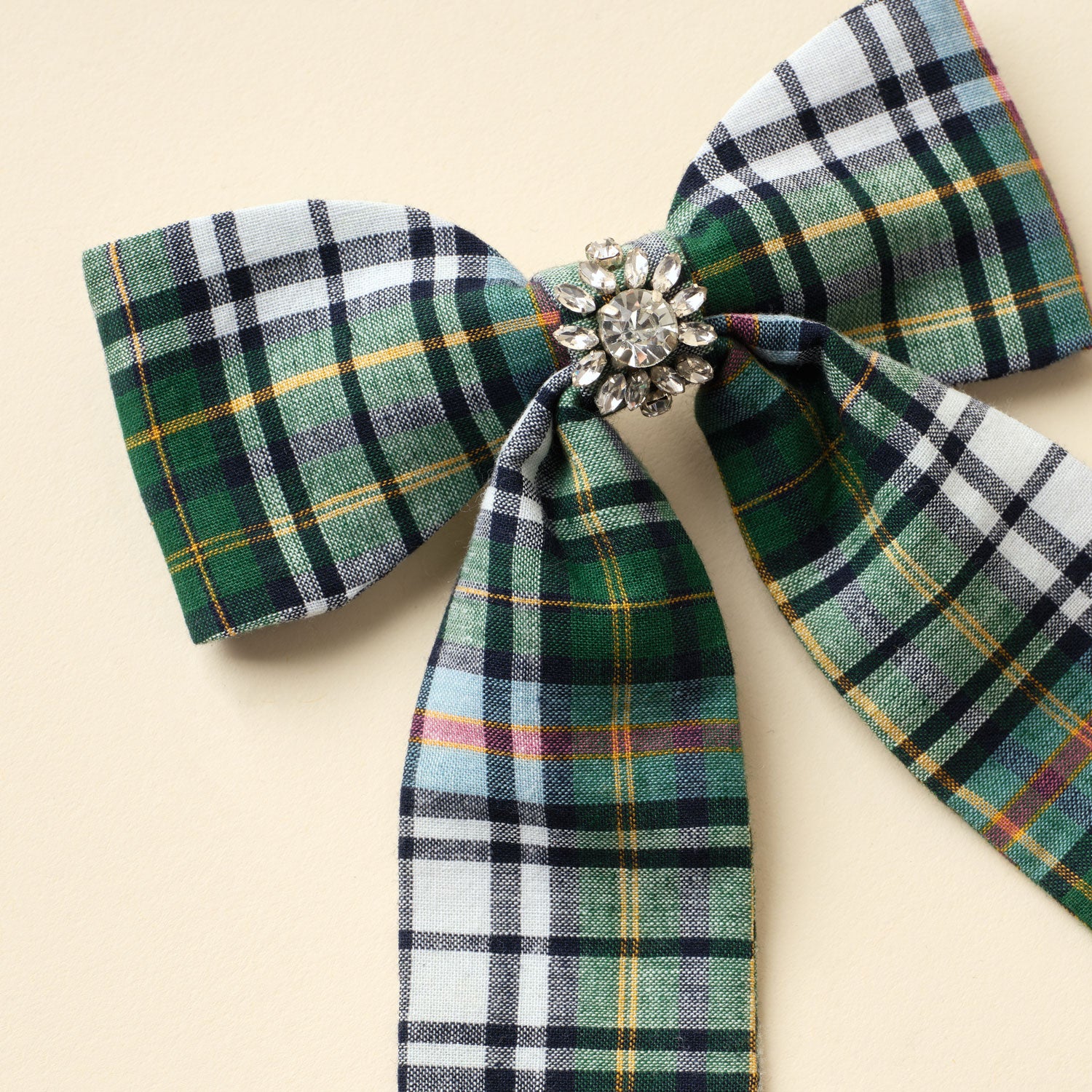 Green Plaid Hair Bow with Crystals on Tan Background