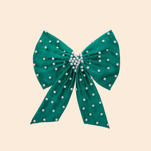 Green Silk Hair Bow with Pearl Embroidery on Tan Background