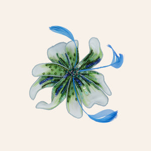 Green and Blue Embroidered and Beaded Jewel Flower Hat Pin Kentucky Derby on Tan Background