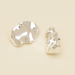 Silver Organic Shaped Stud Earrings on Cream Background