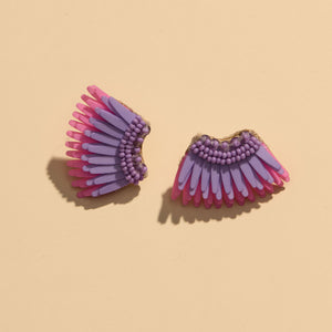 Pink and Purple Sequin and Bead Wing Stud Earrings on Flat Cream Background