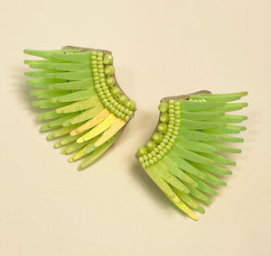 Sparkly Lime Sequin and Bead Wing Earrings on Flat Tan Background