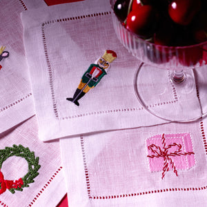 Embroidered Cocktail Napkins Staged with Cocktail Glass Filled with Cherries