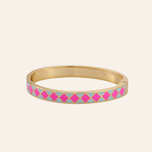 Hot Pink and Blue Enamel and Gold Bangle Bracelet on Tan Background 