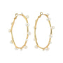 Gold and Pearl Hoop Earrings on White Background