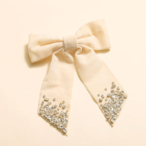 Ivory Hair Bow with Crystal Details on Tan Background