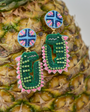Pineapple with decorative earrings on a blurred background