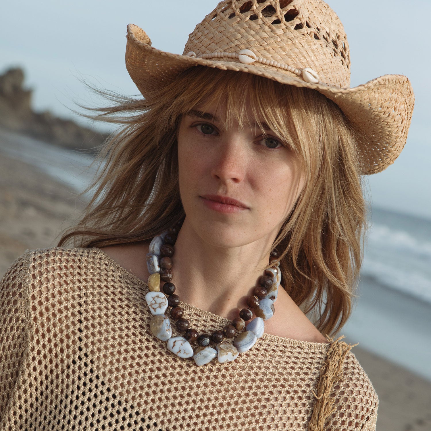 Light Blue and Sand Colored Beaded Strand Necklace Styled on Model with Brown Beaded Strand