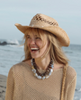 Light Blue and Sand Colored Beaded Strand Necklace Styled on Model with Brown Beaded Strand