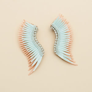 Blue and Ivory Sequin Wing Stud Earrings on Cream Background