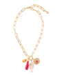 Gold chain necklace with colorful pendant on a white background