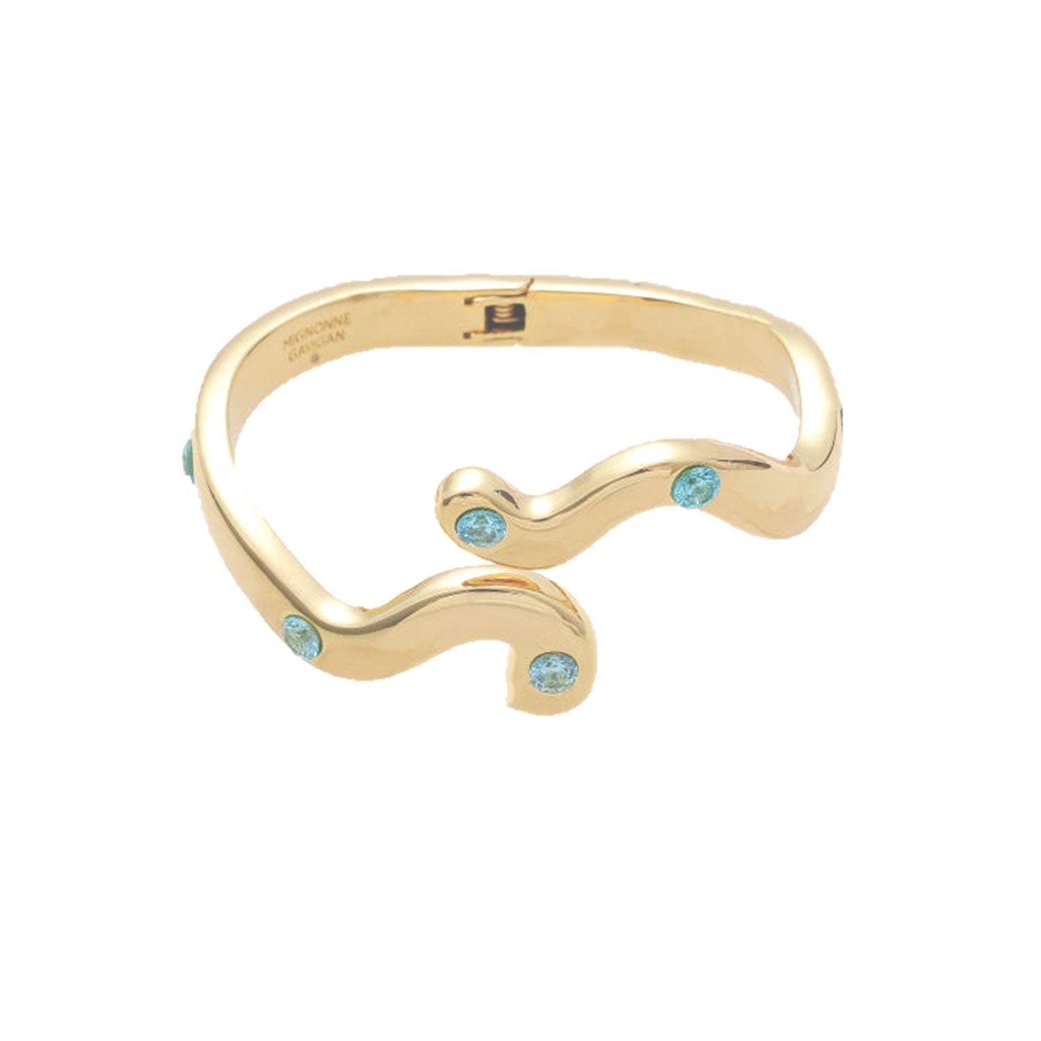 Gold bracelet with turquoise stones on a white background