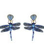 A pair of dragonfly drop earrings featuring blue and gold beaded wings, a light blue faceted gemstone top, and dangling blue beads, shown on a plain white background.