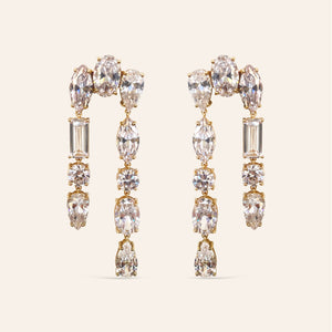 Clear Crystal Drop Earrings Styled on Cream Background