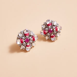 Bead and Crystal Studs with Pink Accent on Cream Background