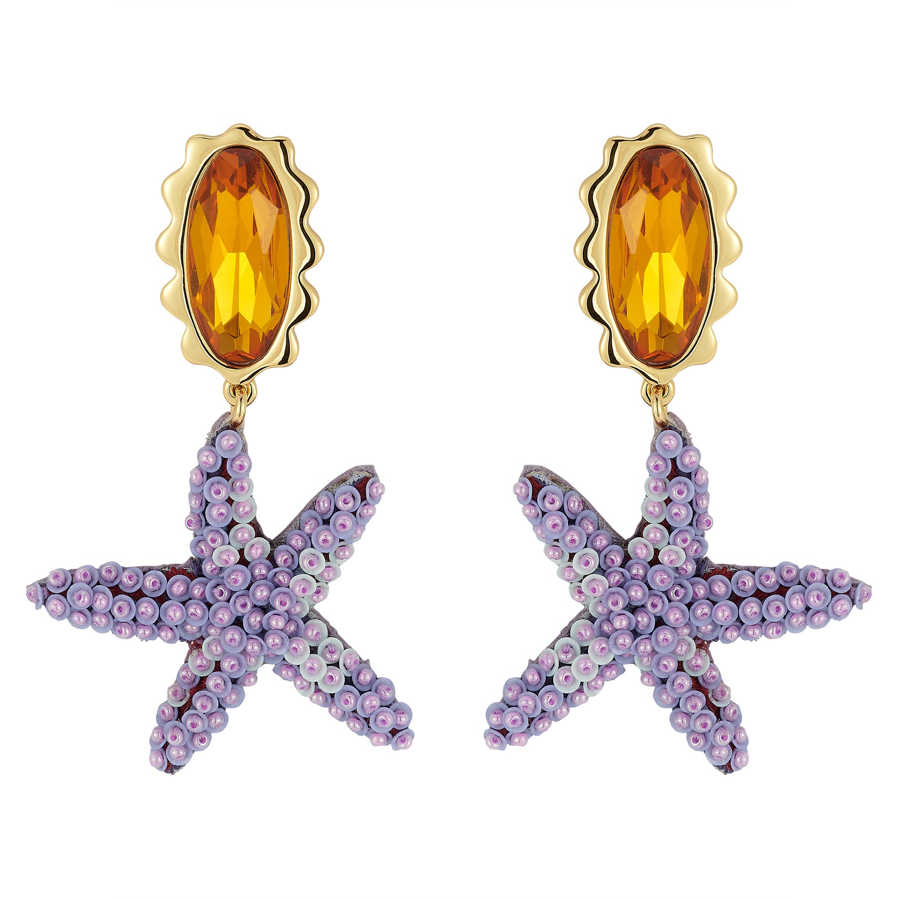 Starfish-shaped earrings with orange gemstones on a white background