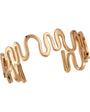 Gold Cuff Bracelet on Flat White Background
