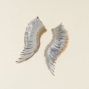 Silver Sequin Wing Stud Earrings on Cream Background