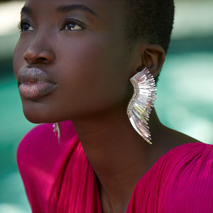 Silver Sequin Wing Stud Earrings Styled on Model in Pink Dress