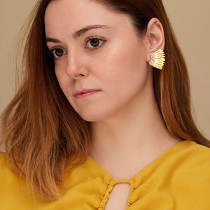 Reflective Yellow and Orange Sequin and Bead Wing Earrings on Model in Orange Dress