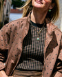 Model wearing green semi precious stone mini sized pendant on a gold link chain necklace