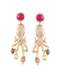 Gold octopus-shaped earrings with colorful gemstones on a white background