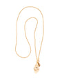 Long gold chain necklace with shell shaped pendant on white background